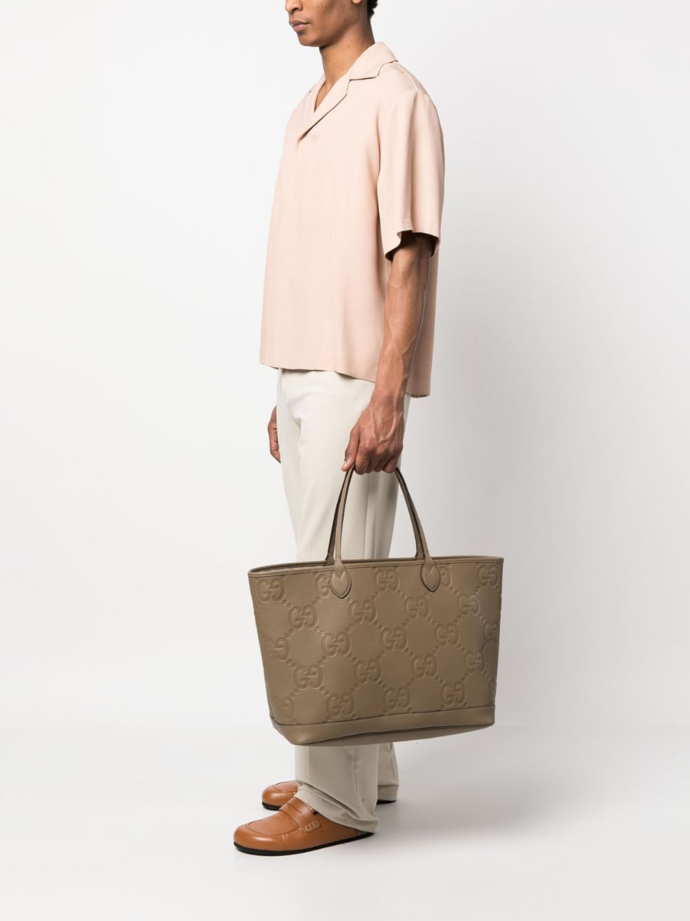 G*u*i all-over logo tote bag