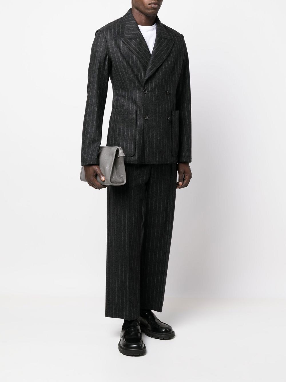 G*u*i gg monogram-embossed clutch bag