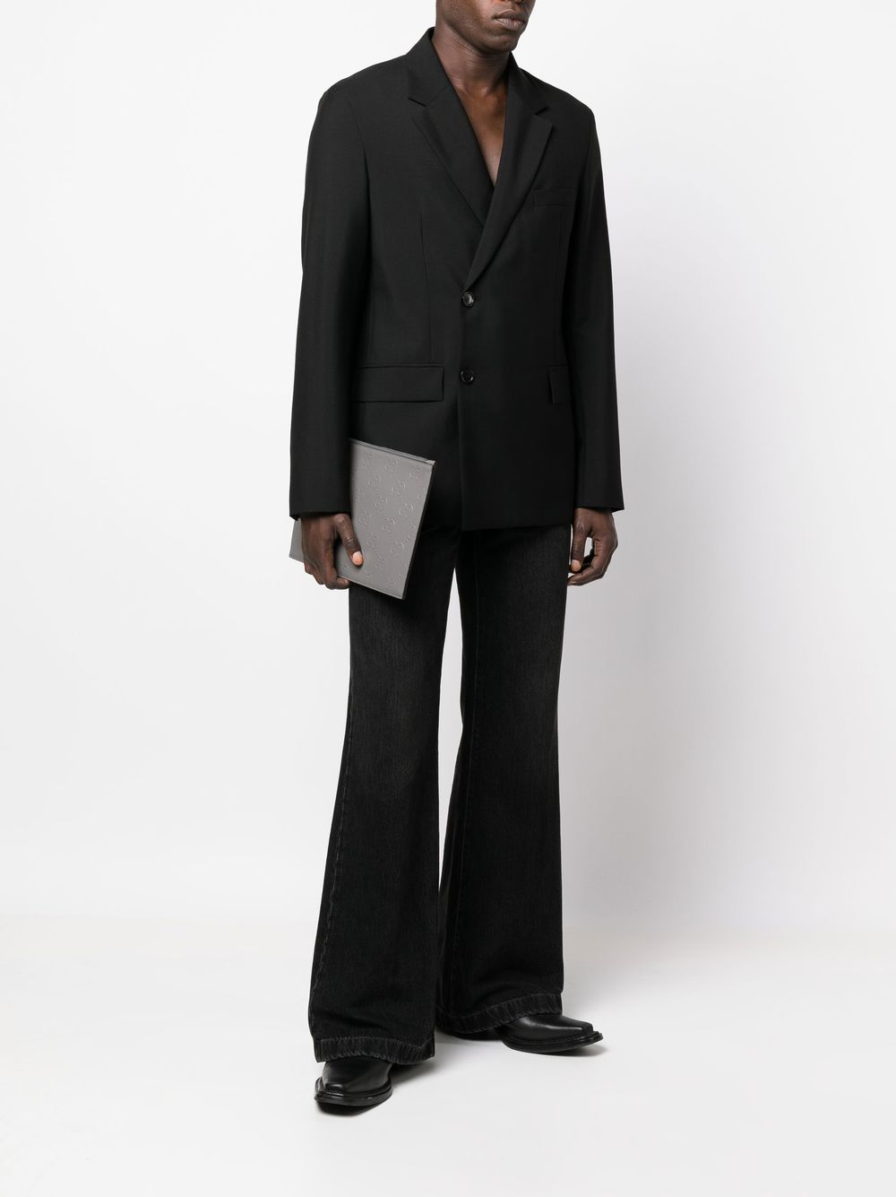 G*u*i gg monogram-embossed clutch