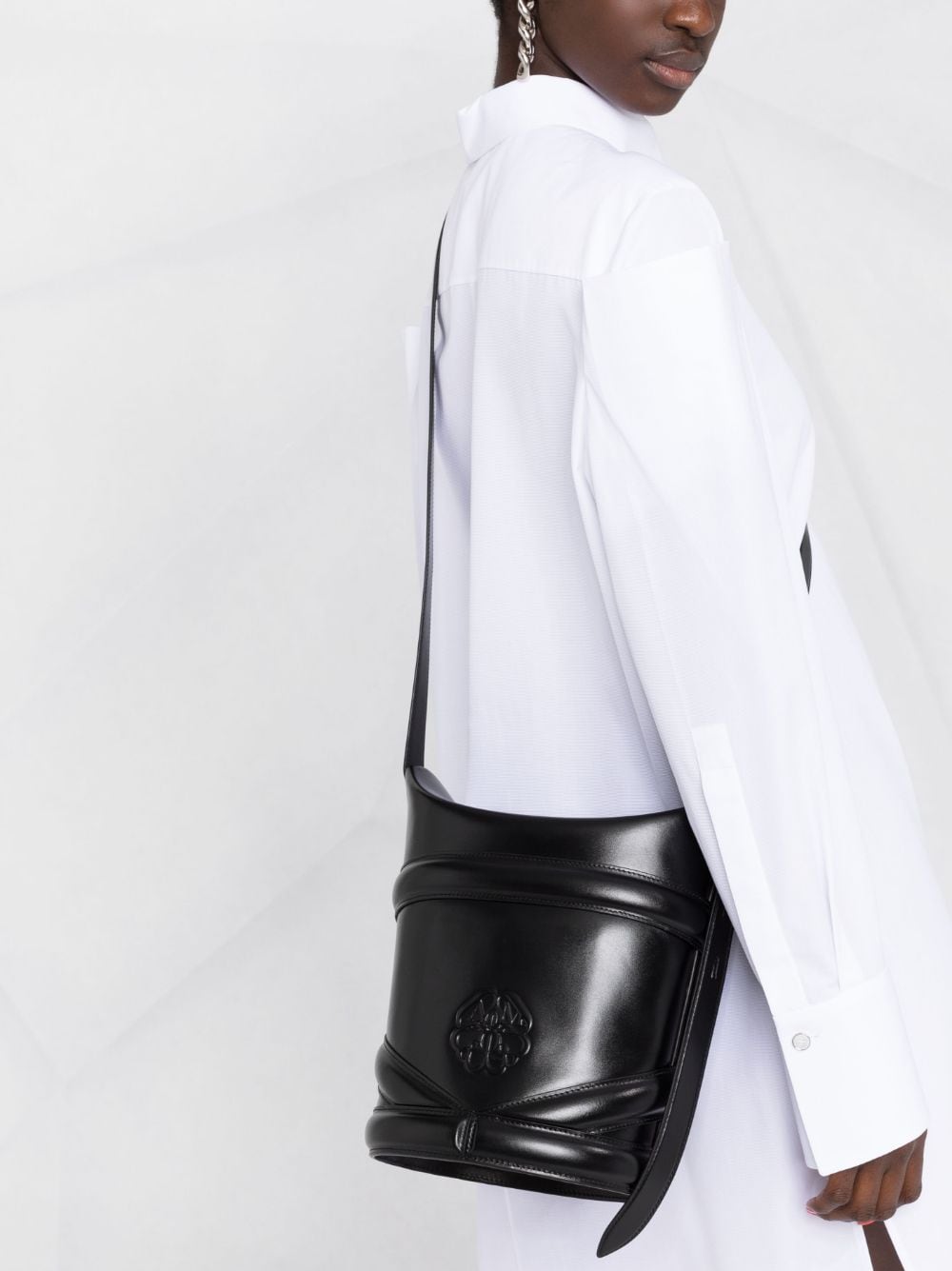 Alexander McQueen embossed-logo bucket bag